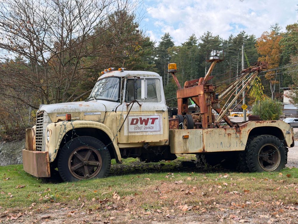 The old International Loadstar wrecker in the yard, still carrying the DWT shield