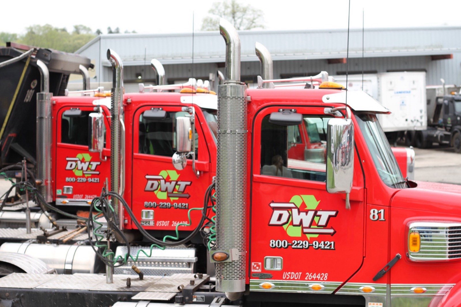 A line of red DWT tractors at the yard