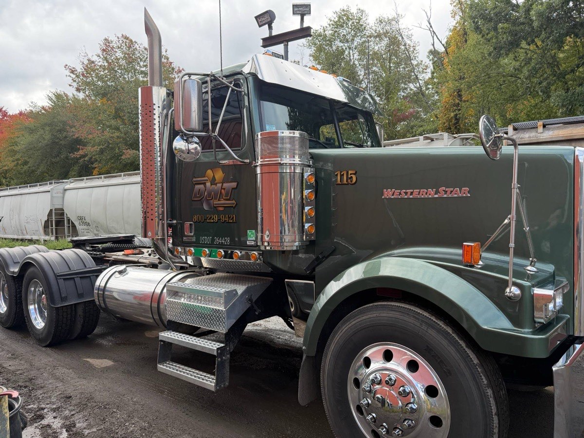 Unit 115, a green Western Star, in the yard